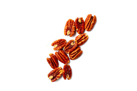 Delicious salted pecan nuts scattered.