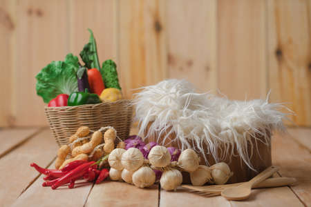 Vegetable in basket , potato , onion , garlic , pepper , carrot , peanut.の写真素材