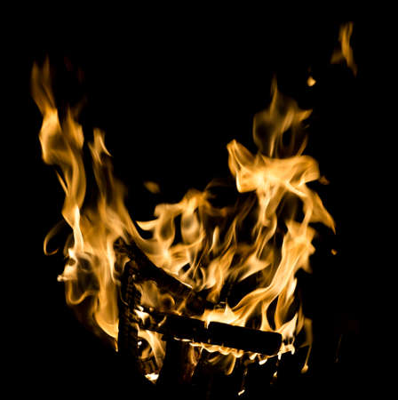 Flames of burning fire isolated on black backgroundの写真素材