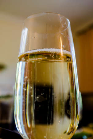 Glass of champagne with bubbles macro photographyの写真素材