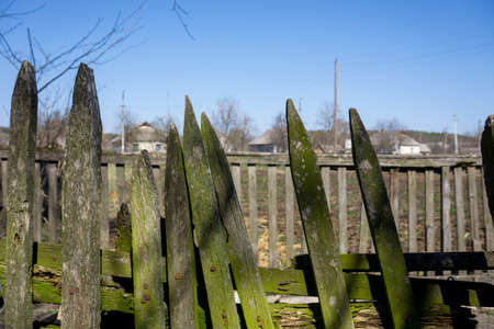Old wooden fence on background blue skyの写真素材