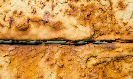Junction of two rusty metal plates texture backgroundの写真素材