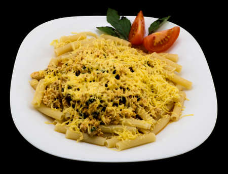 Dish of meat, vegetables, spices, basil, herbs and cheese - pasta alla carbonara isolated on blackの写真素材