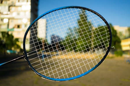 Tennis badminton racket in the city street background