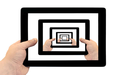 Tablet PC in hand looped on screen isolated on white