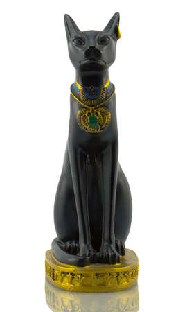 Statuette of black egyptian cat with gold isolated on white filteredの写真素材