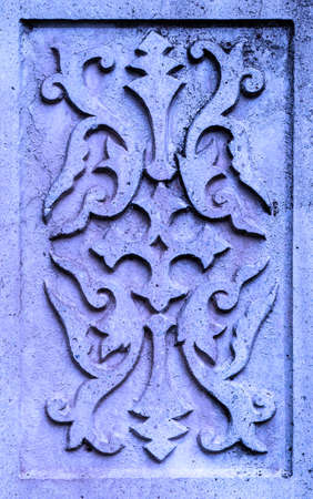 Ancient violet stone plate with vintage ornamentの写真素材