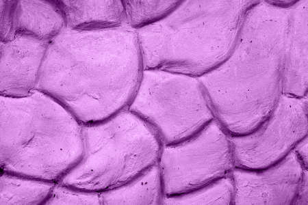 Texture of violet wall plastered in form of big stonesの写真素材