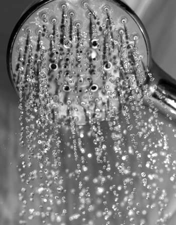 Water drops close-up dripping from the shower black and whiteの写真素材