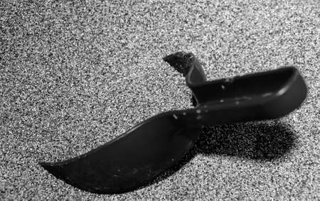 Out of focus shovel in a box with poppy seeds black and white macro backgroundの写真素材