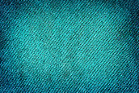 Blue fabric woven texture high contrasted with vignetting effect macro backgroundの写真素材