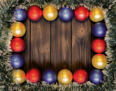 New year theme: christmas decoration and balls on brown retro stylized wood background warm filteredの写真素材