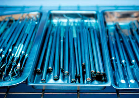 Dental instruments kit in the trays blurred backgroundの写真素材