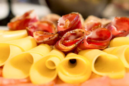 Sliced bacon and cheese macro blurred backgroundの写真素材