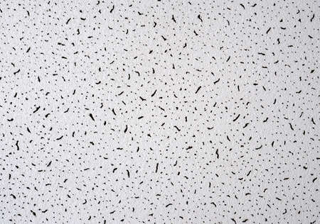 White abstract grunge paper macro texture with black spotsの写真素材