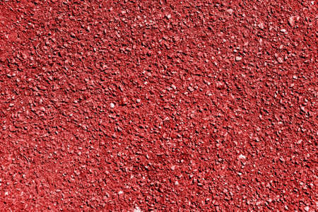 Red earth and gravel macro texture backgroundの写真素材