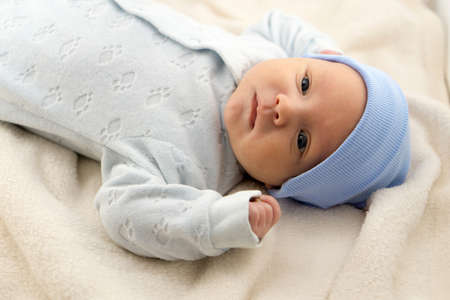 Cute newborn baby lying in the bed. Stock photoの写真素材
