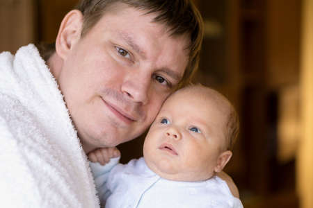 Cute newborn baby in father's hands. Stock photoの写真素材