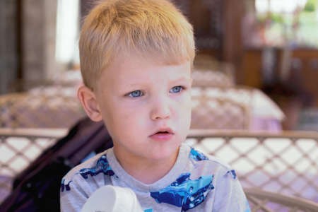Little boy portrait on summer holidays in the restaurant