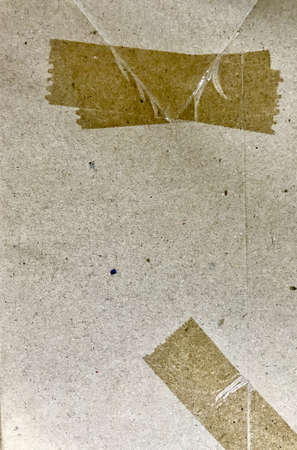 Plastic tape on brown paperの写真素材