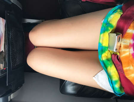 Airplane cabin is all white. All its decorations are necessary stuffs and safety. The gray Tray...