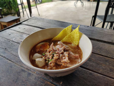 small flat rice noodles with fish balls and shrimp balls in pink soup, Yen Ta Four or Yen Ta Fo - Asian food style. Thai noodle style with pork and pork balls. Tom Yum soup. Num Tok soup. Boat Noodlesの写真素材