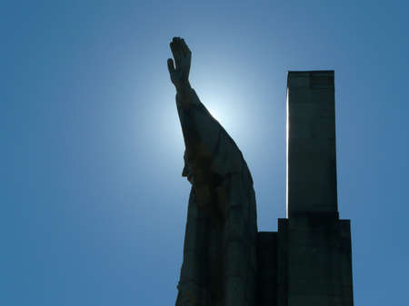 statue of jesus christ in blue skyの写真素材