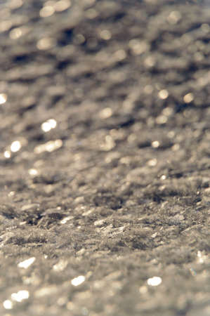 Sparkling snow flakes in winter sunの写真素材
