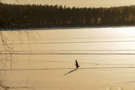 Children in Scandinavia winter sunsetの写真素材