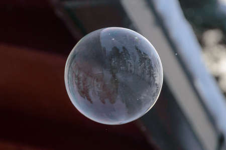flying deep frozen soap bubbleの写真素材
