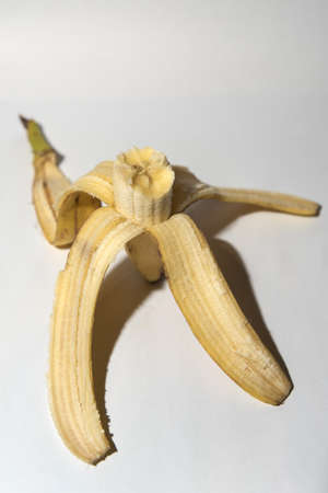 Realistic picture of half eaten bananaの写真素材