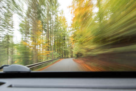 danger situation on slippy autum roadの写真素材