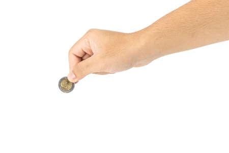 Coin in the hand Of Thailand in hand on a white background This is a Thai currency unit coin, money saving concept. 1 baht, 2 baht, 5 baht, 10 bahtの写真素材