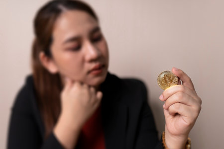 business woman holding bitcoin coins in hand concept cryptocurrency exchange. technology and investment digital. finance, Trader, investor, gold Bitcoin Cashの写真素材