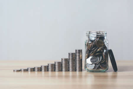 rising coin pile. business and finance growth concept. Income growth. Wealth investor. save money for the future. Financial saving increase.の写真素材