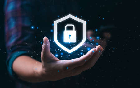 internet security concept and cyber networks. man holding shield icon virtual with lock symbol with...