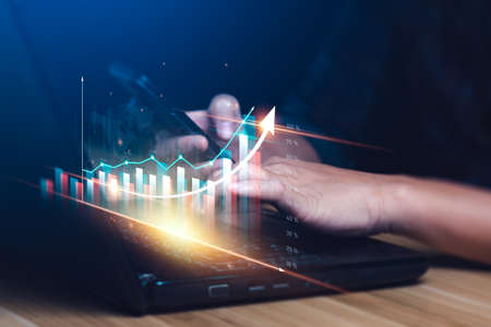 Digital online marketing, Businessman using tablet to analyze sales data and Economic growth chart...
