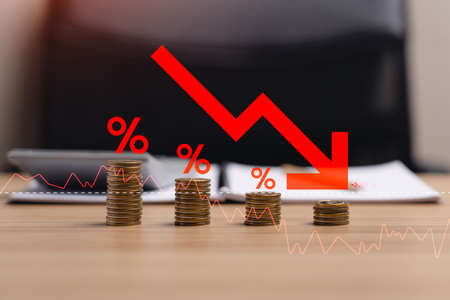 Concept inflation, Condition in which the price of goods and services continues to increase. Economic conditions in which the currency tends to decline continuously. pile of coins and red arrowの写真素材