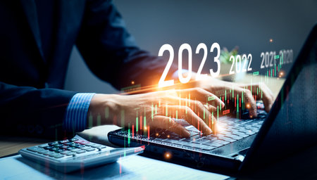 stock market trends for 2023, Businessman calculating financial data for long term investments. Analytical businessman planning business growth 2023 with future economic growth arrow graphic. strategyの写真素材