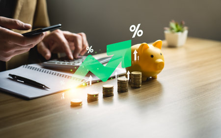 higher interest rates and dividends, pile of coins and percentage of company profits. saving money...