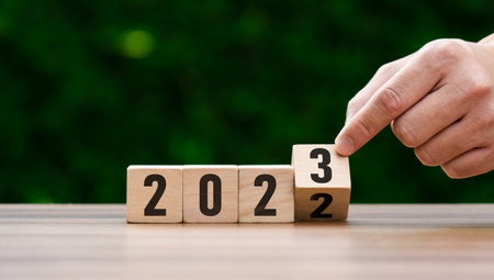 2023 business ideas and market trends concept, goal, action plan, strategy, new year business vision. hand holding goal and cubes with text 2023. Development to success and motivation. target groupの写真素材