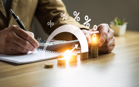 Interest rate and dividend concept, Businessman is calculating income and return on investment in percentage. income, return, retirement, compensation fund, investment, dividend tax, stock marketの写真素材