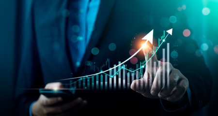 Businessman using laptop and analyzing economic growth, financial graph and business investment. planning strategy, stock market statistics, stock market trends, technical analysis strategy, valueの写真素材
