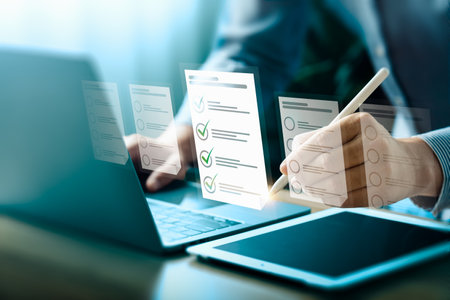 Business performance checklist, businessman using laptop doing online checklist survey, Check marks...