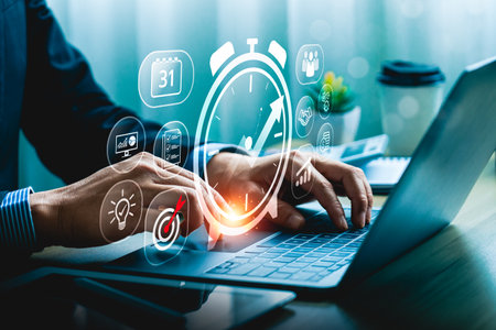 Businessman Managing Time Effectively with Digital Productivity Tools and Data Analytics on Laptop,...