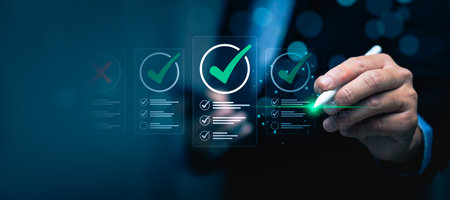Business Professional Using Digital Pen to Mark Checklists on a Virtual Screen with Green Checkmarks, Demonstrating Task Management, Quality Assurance, Project Planning, Successful Goal Achievementの写真素材