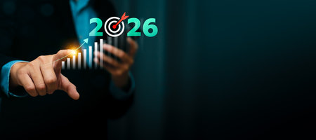 Businessman pointing at rising bar chart with 2026 target goal and bullseye icon, symbolizing business growth strategy, future planning, financial success, marketing objectives, performance forecastの写真素材