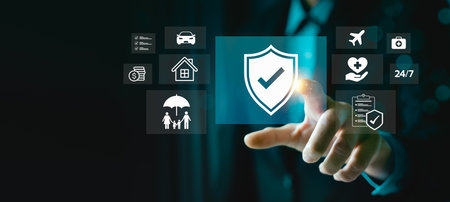 Digital insurance services and financial protection concept with businessman hand pointing at shield check mark icon surrounded by coverage options for home, car, family, health, travel, 24/7 supportの写真素材