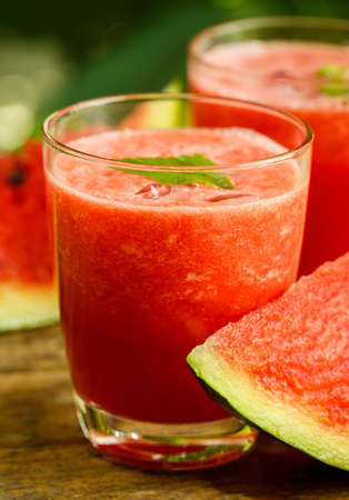 Watermelon juice on a wooden tableの写真素材