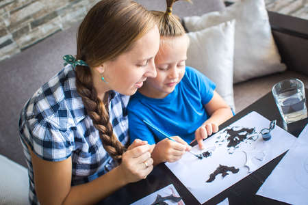 Mom with 4 years old son draw  flying mouseの写真素材